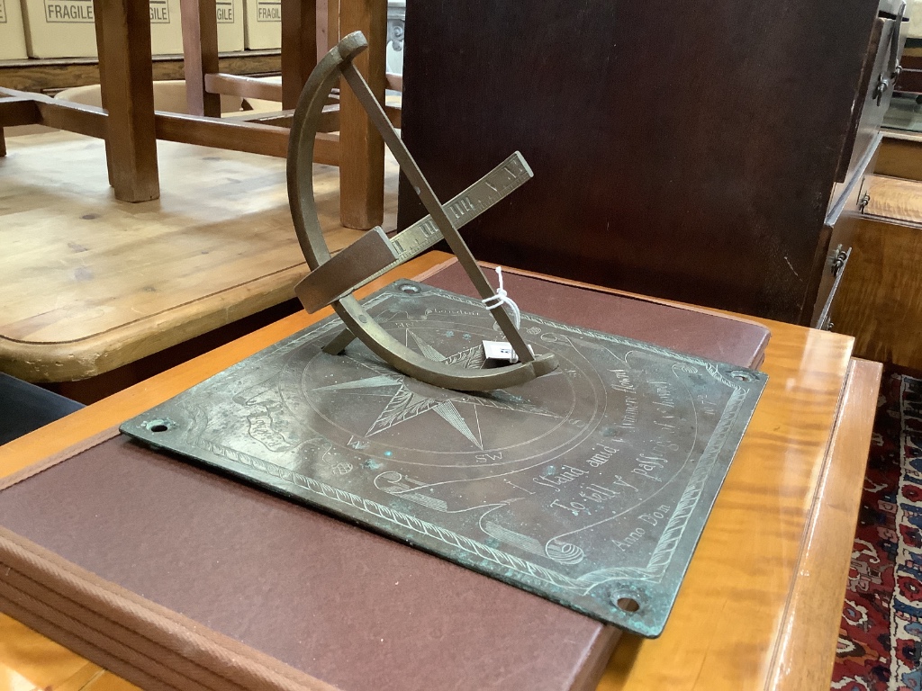 A 17th century style engraved brass sundial, width 30cm, depth 31cm, height 20cm